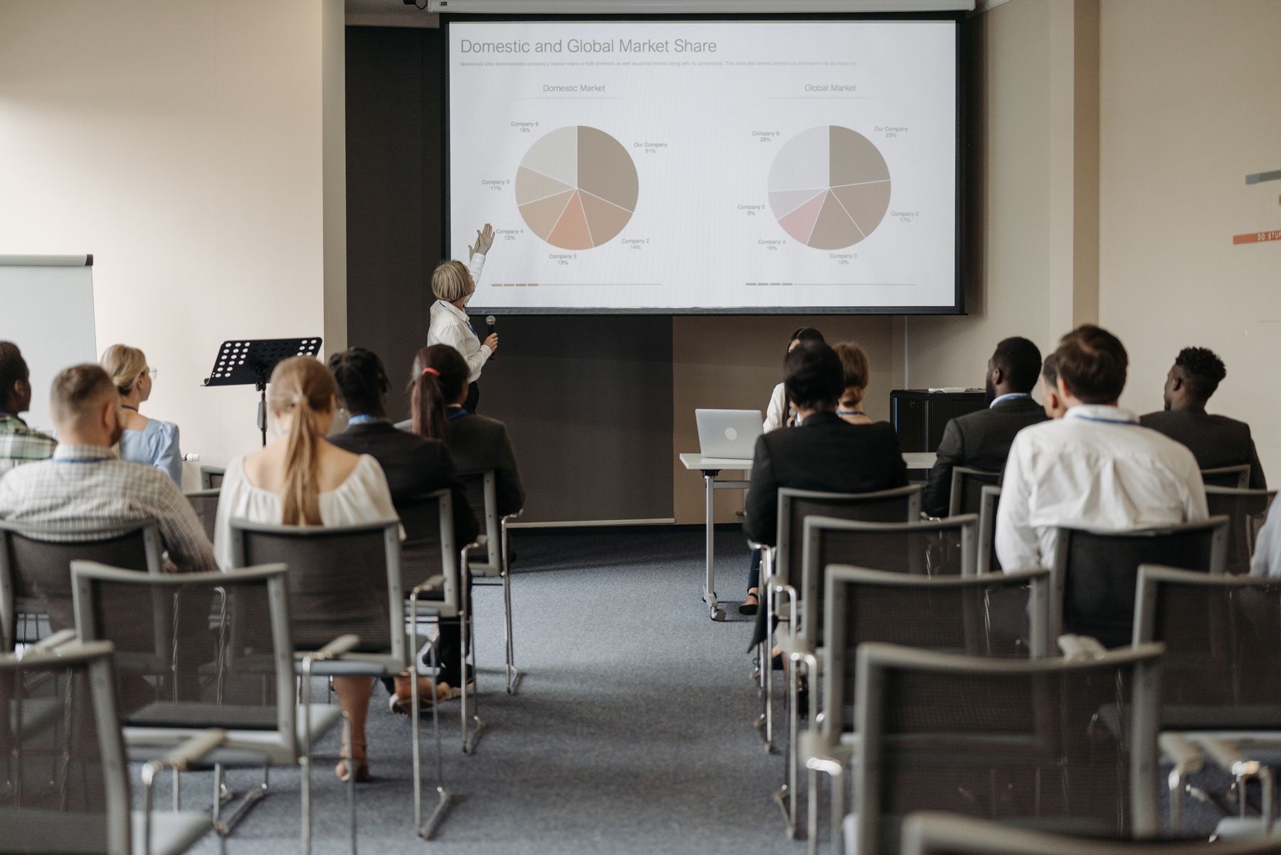 Participants at a training session facing a presenter